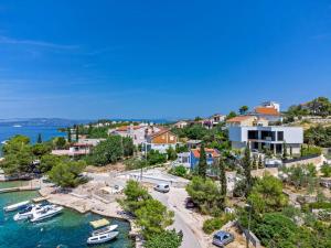 an aerial view of a resort with boats in the water at Luxury Beachfront Villa Raquel with Private Pool & Gym at Šolta, Croatia in Nečujam