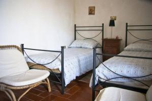 A bed or beds in a room at La Prediletta Country House