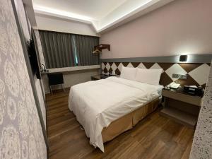 En eller flere senger på et rom på Weifeng Boutique Business Hotel - Zhanqian Branch