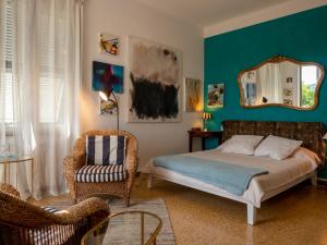 Postel nebo postele na pokoji v ubytování Cinque terre affittacamere Atelier ouvert!