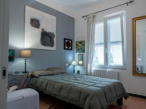Postel nebo postele na pokoji v ubytování Cinque terre affittacamere Atelier ouvert!
