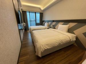 En eller flere senger på et rom på Weifeng Boutique Business Hotel - Zhanqian Branch