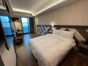En eller flere senger på et rom på Weifeng Boutique Business Hotel - Zhanqian Branch