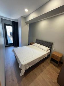 Ένα ή περισσότερα κρεβάτια σε δωμάτιο στο Almin Apart Hotel