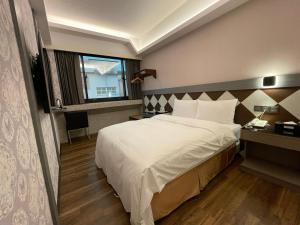 En eller flere senger på et rom på Weifeng Boutique Business Hotel - Zhanqian Branch