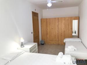 Postel nebo postele na pokoji v ubytování CoLiving Ulloa
