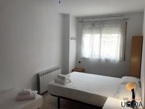 Postel nebo postele na pokoji v ubytování CoLiving Ulloa