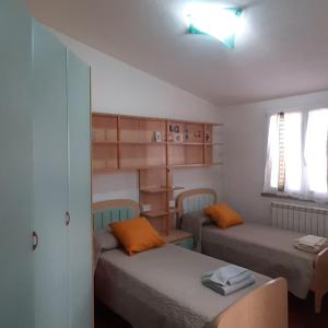 Tempat tidur dalam kamar di B&B Casa Viola