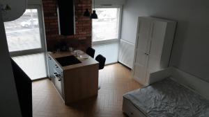 Posteľ alebo postele v izbe v ubytovaní Apartament Zamkowy