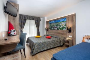 Postel nebo postele na pokoji v ubytování Hotel Alpen