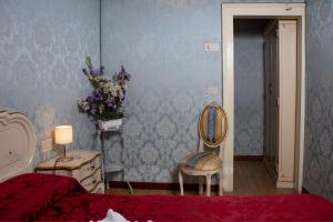 Łóżko lub łóżka w pokoju w obiekcie Locanda Casa Martini