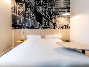 Postel nebo postele na pokoji v ubytování ibis Styles Limoges Centre