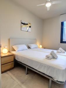 En eller flere senge i et værelse på Antilia Terraces 3 - Apartment 4709