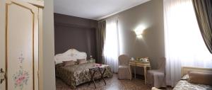 Łóżko lub łóżka w pokoju w obiekcie Locanda Casa Martini