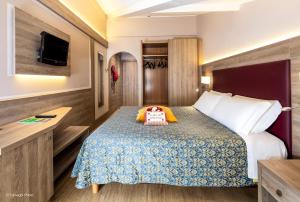 Postel nebo postele na pokoji v ubytování Hotel Alpen