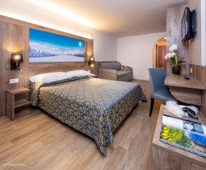 Postel nebo postele na pokoji v ubytování Hotel Alpen