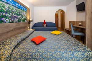 Postel nebo postele na pokoji v ubytování Hotel Alpen