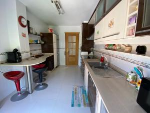Kuchyňa alebo kuchynka v ubytovaní Altavista Apartment