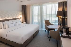 Cama ou camas em um quarto em Meliá Frankfurt City
