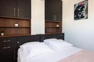 A bed or beds in a room at Analogy chania apartment