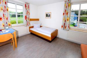 Ein Bett oder Betten in einem Zimmer der Unterkunft St. Bonifatius