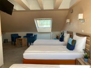 Postel nebo postele na pokoji v ubytování Hotel am Hafen