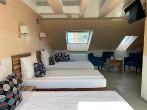 Postel nebo postele na pokoji v ubytování Hotel am Hafen