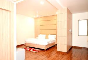 Postel nebo postele na pokoji v ubytování Hotel Pradeep Star Inn