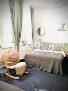 Postel nebo postele na pokoji v ubytování Sleephotels Suite Garde