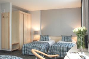 Posteľ alebo postele v izbe v ubytovaní Hotel Perła