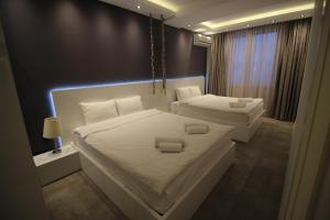 Postel nebo postele na pokoji v ubytování Super Luxury Apartments