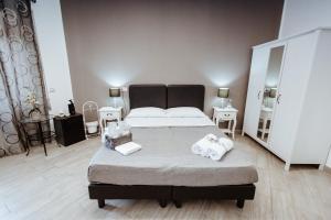 Łóżko lub łóżka w pokoju w obiekcie Wanderlust Relais Vaticano