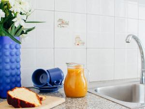 a loaf of bread and a glass of orange juice at Klima Paradise in Klíma
