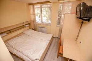 Ένα ή περισσότερα κρεβάτια σε δωμάτιο στο Arsego Hostel