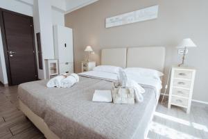 Łóżko lub łóżka w pokoju w obiekcie Wanderlust Relais Vaticano