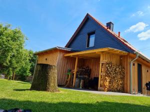 a house with a lot of wood at Ferienhaus Darlingerode in Darlingerode