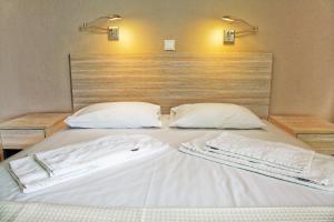 Postel nebo postele na pokoji v ubytování Hotel Stella