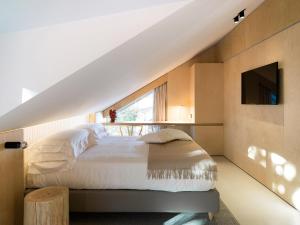 Postel nebo postele na pokoji v ubytování Criu Boutique Hotel