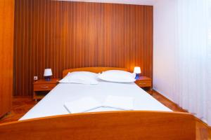 Posteľ alebo postele v izbe v ubytovaní Apartmani Vranjes