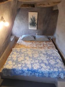 A bed or beds in a room at Alonaki Tinos Rental Cottage house