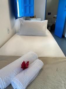 Säng eller sängar i ett rum på Pousada Cocar Caraíva