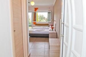 Postel nebo postele na pokoji v ubytování Hotel Stella