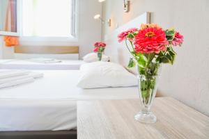 Postel nebo postele na pokoji v ubytování Hotel Stella