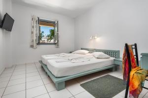 A bed or beds in a room at Aphea Village