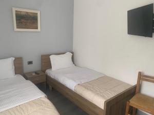 Postel nebo postele na pokoji v ubytování Hotel Osumi