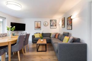 a living room with a couch and a table at Spacious 3 bedroom apt in Covent Garden in London