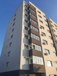 a tall building with balconies on the side of it at CASA LIVIA in Slatina