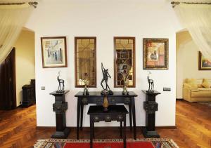 a room with a table with some statues on it at Berbère Palace in Ouarzazate