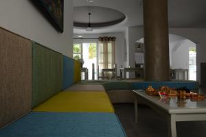 a living room with a couch and a table at Hippocampus Hotel in Kamari