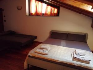 A bed or beds in a room at Mansarda Chanoux CIR n 0027